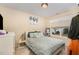 Cozy bedroom with a comfortable bed, side table, and a window with blinds at 702 Blue Lake Dr, Mebane, NC 27302