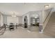 Open concept dining area connecting to the living room and staircase at 702 Blue Lake Dr, Mebane, NC 27302