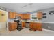 Functional kitchen with wooden cabinets, modern appliances, and a convenient layout at 702 Blue Lake Dr, Mebane, NC 27302