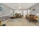 Cozy living room with plush seating, a ceiling fan, and neutral color palette at 702 Blue Lake Dr, Mebane, NC 27302