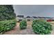 Backyard features lush green bushes at 7727 Weathered Oak Way, Raleigh, NC 27616
