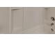 Bathtub features a shower head and built-in shelves at 7727 Weathered Oak Way, Raleigh, NC 27616