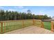 Back deck overlooking a tree-lined backyard of a lovely new home at 78 Fair Child Rd, Spring Lake, NC 28390