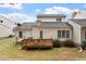 Exterior of home with a wooden deck and a well-maintained lawn at 800 Mill Greens Ct, Raleigh, NC 27609