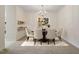 A bright dining area featuring modern chandelier and dining set perfect for hosting dinner parties and Gathering meals at 800 Mill Greens Ct, Raleigh, NC 27609
