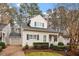 Quaint two-story home with attached garage, blue shutters, and landscaped front yard at 800 Mill Greens Ct, Raleigh, NC 27609