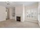 Comfortable living room featuring a fireplace, built-in shelves, and ample lighting at 800 Mill Greens Ct, Raleigh, NC 27609