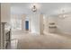 Spacious living room with abundant natural light, fireplace, and open layout, perfect for comfortable living at 800 Mill Greens Ct, Raleigh, NC 27609