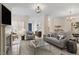 Inviting living room featuring a cozy fireplace, contemporary furnishings, and seamless flow to the dining area at 800 Mill Greens Ct, Raleigh, NC 27609