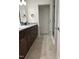 Bathroom view featuring vanity, mirror, and door leading to toilet and shower area at 812 Kenmore Ave, Louisburg, NC 27549