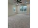 Spacious bedroom with large windows, gray carpet, and neutral-colored walls at 812 Kenmore Ave, Louisburg, NC 27549