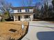 Inviting two-story home with a well-maintained lawn and a long driveway at 812 Kenmore Ave, Louisburg, NC 27549