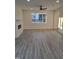 Open living room with natural light, vinyl plank flooring, and a decorative fireplace at 812 Kenmore Ave, Louisburg, NC 27549