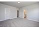 Spacious bedroom featuring neutral walls and plush carpet with attached bathroom view at 88 Windchime Ct, Fuquay Varina, NC 27526
