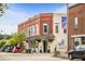 Charming corner building featuring unique architecture and signage, located in the heart of downtown at 88 Windchime Ct, Fuquay Varina, NC 27526