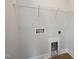 Functional laundry area equipped with wire shelving and washer/dryer hookups at 88 Windchime Ct, Fuquay Varina, NC 27526