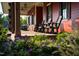 Inviting porch with rocking chairs and lush landscaping, perfect for relaxing evenings and socializing at 88 Windchime Ct, Fuquay Varina, NC 27526