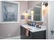 Stylish bathroom featuring double sinks, framed mirrors, and modern fixtures for a sleek and functional space at 1005 W Club Blvd, Durham, NC 27701