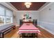 Dining room featuring hardwood floors, modern light fixture, and lots of natural light at 1005 W Club Blvd, Durham, NC 27701