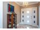 Welcoming entryway with a vintage display cabinet and a modern chandelier for a touch of elegance at 1005 W Club Blvd, Durham, NC 27701