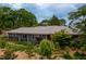 Well-maintained exterior of the home featuring a gray roof and lovely landscaped yard at 1005 W Club Blvd, Durham, NC 27701