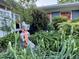 Well-manicured garden area with statue, flowering bushes, and lush greenery at 1005 W Club Blvd, Durham, NC 27701