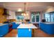 Bright kitchen with blue cabinets, a large island, stainless steel appliances, and a farmhouse sink at 1005 W Club Blvd, Durham, NC 27701