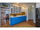 Stylish kitchen area showcasing blue lower cabinets, a sink, and modern appliances at 1005 W Club Blvd, Durham, NC 27701