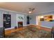 Bright living room with fireplace, hardwood floors, and built-in bookshelves at 1005 W Club Blvd, Durham, NC 27701