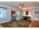 Open-concept living room with hardwood floors, neutral walls and lots of natural light at 1005 W Club Blvd, Durham, NC 27701