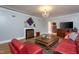 Cozy living room with fireplace, hardwood floors, and comfortable seating at 1005 W Club Blvd, Durham, NC 27701