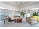 Sunroom with neutral tones and comfortable seating at 1005 W Club Blvd, Durham, NC 27701