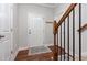 Inviting entryway with hardwood floors, a front door with window, and stairs leading to the upper level at 10504 Carsons Creek Dr, Zebulon, NC 27597