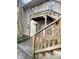 Exterior unit entrance featuring covered staircase and concrete walkway at 1513 E Franklin St # C129, Chapel Hill, NC 27514