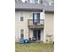 Townhome back exterior with deck, patio, and lawn at 1513 E Franklin St # C129, Chapel Hill, NC 27514