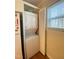 Laundry room with white stackable washer and dryer at 1513 E Franklin St # C129, Chapel Hill, NC 27514