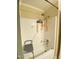 Clean shower with tiled walls, a shower seat, and convenient storage niches at 1513 E Franklin St # C129, Chapel Hill, NC 27514
