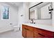 Modern bathroom with a stylish vanity, sleek fixtures, and neutral tile at 1604 Malta Ave, Raleigh, NC 27610