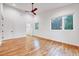 Bedroom with hardwood floors, natural light, and access to closet and ensuite bathroom at 1604 Malta Ave, Raleigh, NC 27610