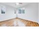 Bright bedroom with hardwood floors and lots of natural light at 1604 Malta Ave, Raleigh, NC 27610