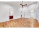 Large primary bedroom with hardwood floors and access to a modern bathroom at 1604 Malta Ave, Raleigh, NC 27610