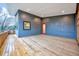 Spacious deck with wood flooring and blue siding, perfect for outdoor entertaining at 1604 Malta Ave, Raleigh, NC 27610