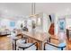 Open concept dining room and living room with modern decor and hardwood floors at 1604 Malta Ave, Raleigh, NC 27610
