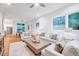 Open living space with neutral furniture, hardwood floors, and access to kitchen and dining at 1604 Malta Ave, Raleigh, NC 27610