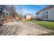 Large brick patio in backyard. Lawn, landscaping and wooded area in background at 1610 Creighton Hall Way, Durham, NC 27703