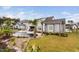 A beautifully landscaped backyard featuring a custom pool, outdoor kitchen, and lush greenery at 1804 Clifton Pines Dr, Cary, NC 27519