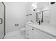 Modern bathroom with sleek white vanity, contemporary fixtures, and a glass-enclosed shower at 1804 Clifton Pines Dr, Cary, NC 27519