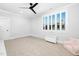 Bright bedroom with shuttered windows, plush carpet, and a charming -sized chair and toybox at 1804 Clifton Pines Dr, Cary, NC 27519