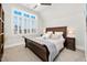 Bedroom featuring vaulted ceilings, light grey walls, and a decorative window at 1804 Clifton Pines Dr, Cary, NC 27519