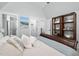 Vaulted bedroom with decorative pillows, built in shelving, and ensuite bathroom at 1804 Clifton Pines Dr, Cary, NC 27519